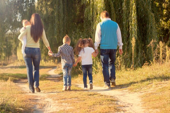 Family Ties concept. Big happy family walking