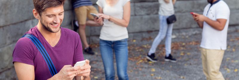 Young people communicate on smartphone