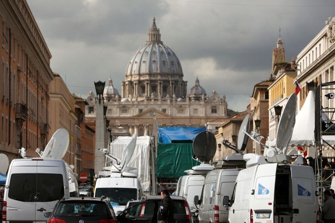 Media descend on St. Peter's Square after the resignation of the Pope